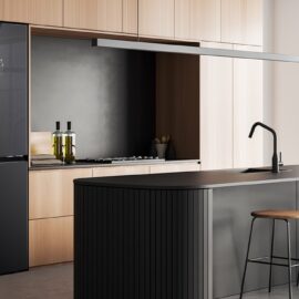 LG four door refrigerator in gloss black, built into a wooden kitchen run beside a black island