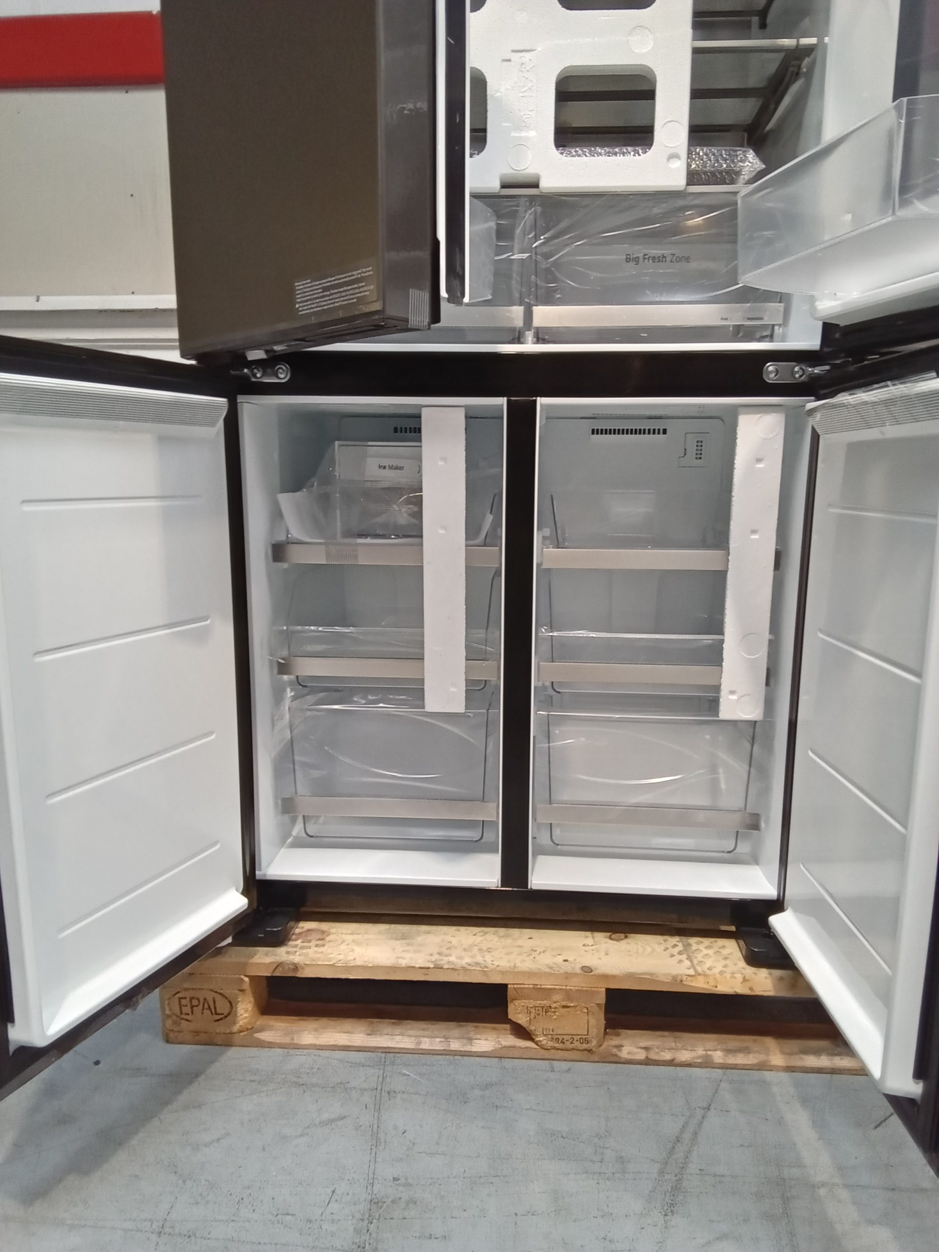 LG GMV960NNME 617L 617L MoodUP™ Multi-Door Fridge Freezer, Colour Changing LED 4 Close view of the open freezer section with wire and clear baskets and an Ice Maker label inside the left compartment