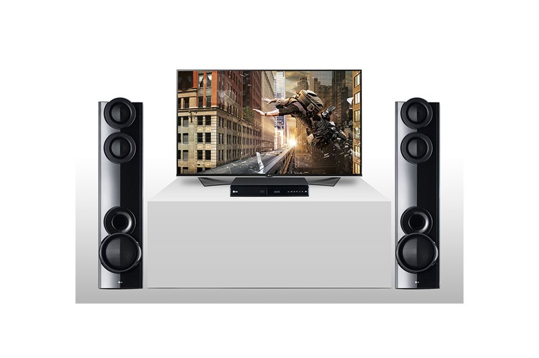 LG LHD675BG 1000W 4.2CH Home Theater System, Dual Subwoofer, AUX IN, USB Direct recording (BODYGUARD) 4 The LG home theatre towers set up on either side of a flat screen TV, main unit on the cabinet