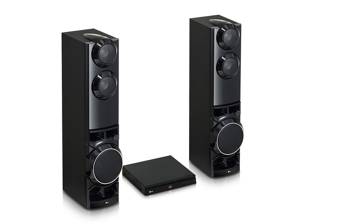 LG LHD687BG 1250W 4 Close angled view of the LG towers with the DVD player between them, showing the twin upper drivers and the disc slot