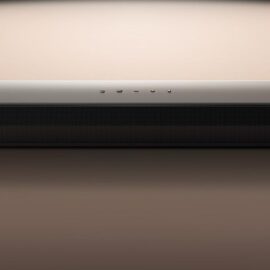 LG S60T soundbar shown straight on, a long black bar with a metal grille front and top mounted buttons