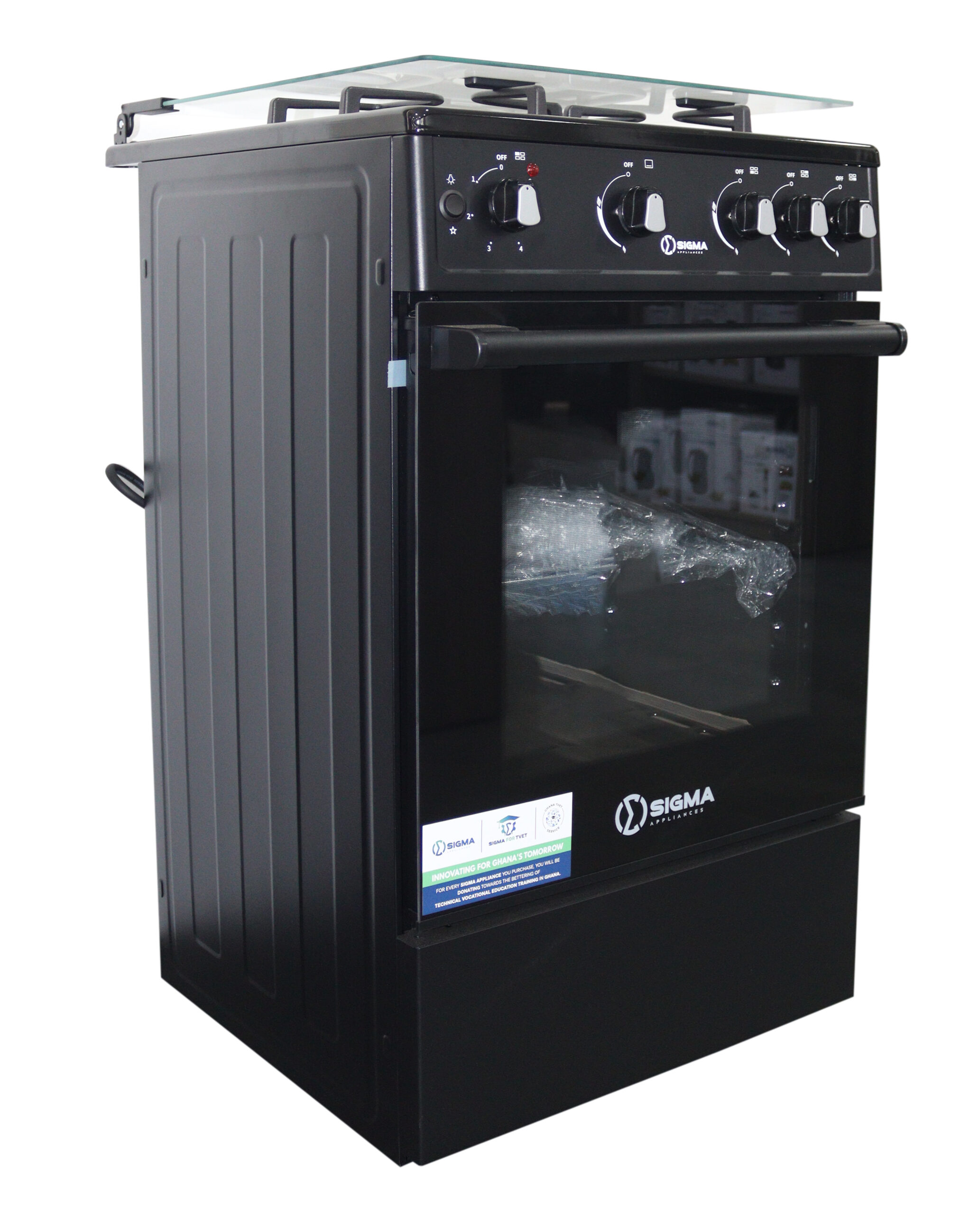 Front right view of the black cooker showing five control knobs in a row, a red indicator light, the glazed oven door with a shelf inside and the glass hob lid raised at the back