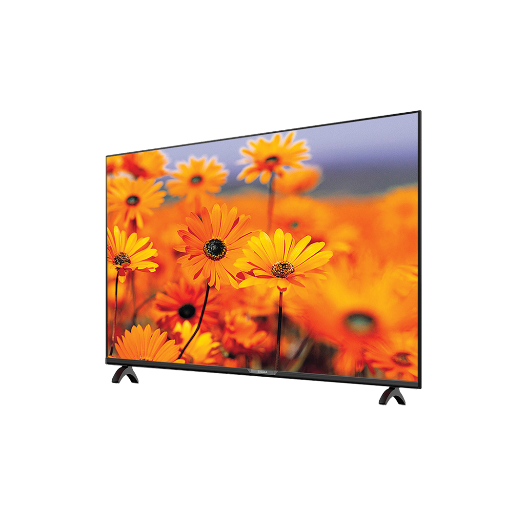 The black Sigma television seen at an angle from the front left, standing on two splayed feet with the Sigma name on the bottom bezel
